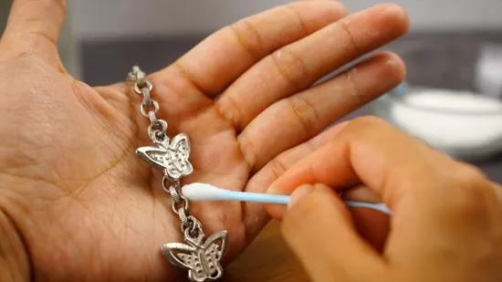 Rub the jewelry gently with a damp tissue, paper towel, or cotton swab.