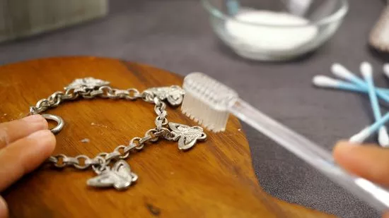 Use a soft, damp toothbrush to clean grooves and intricate details.
