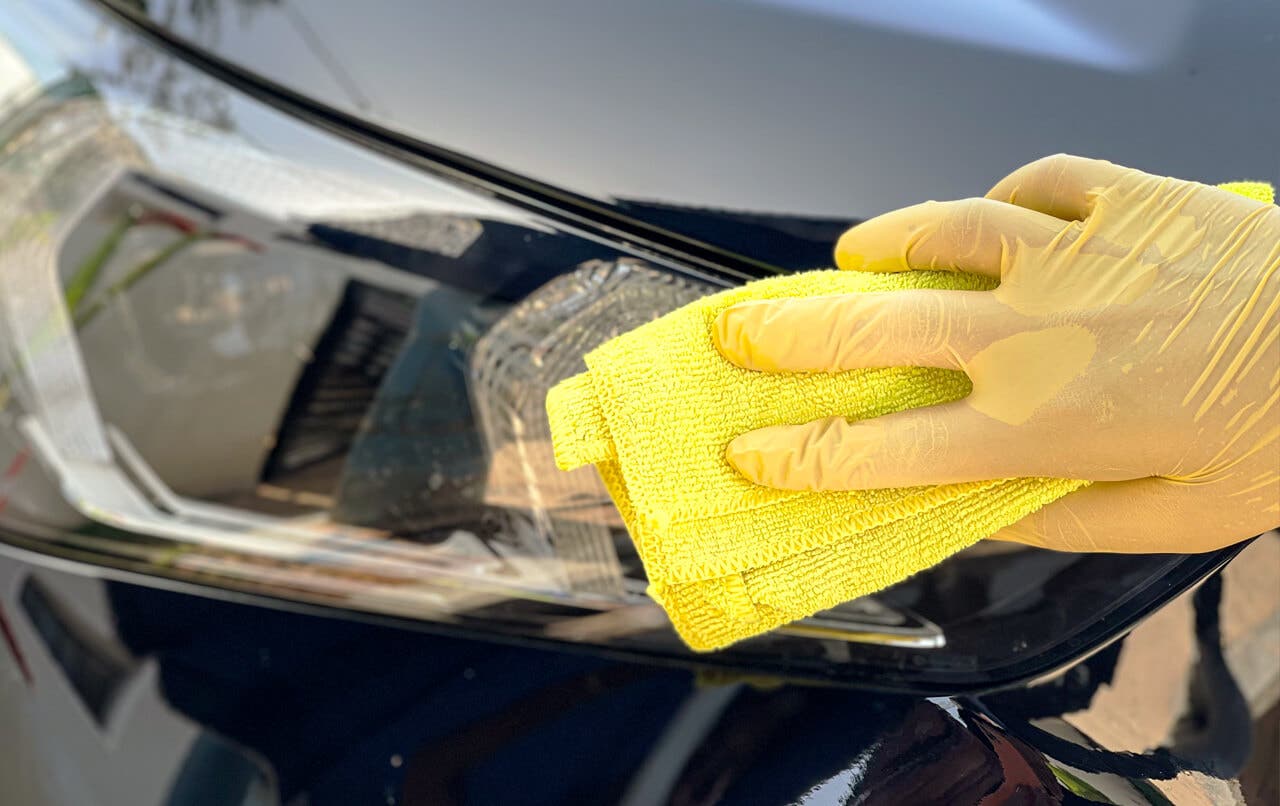 Cleaning car headlights with a cloth