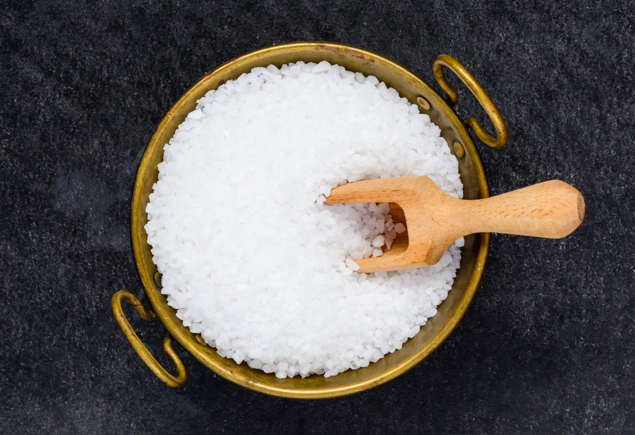 Bowl of Epsom Salt with a Wooden Spoon
