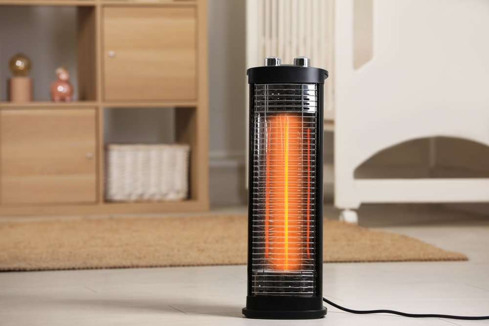 Modern infrared heater in a cozy room
