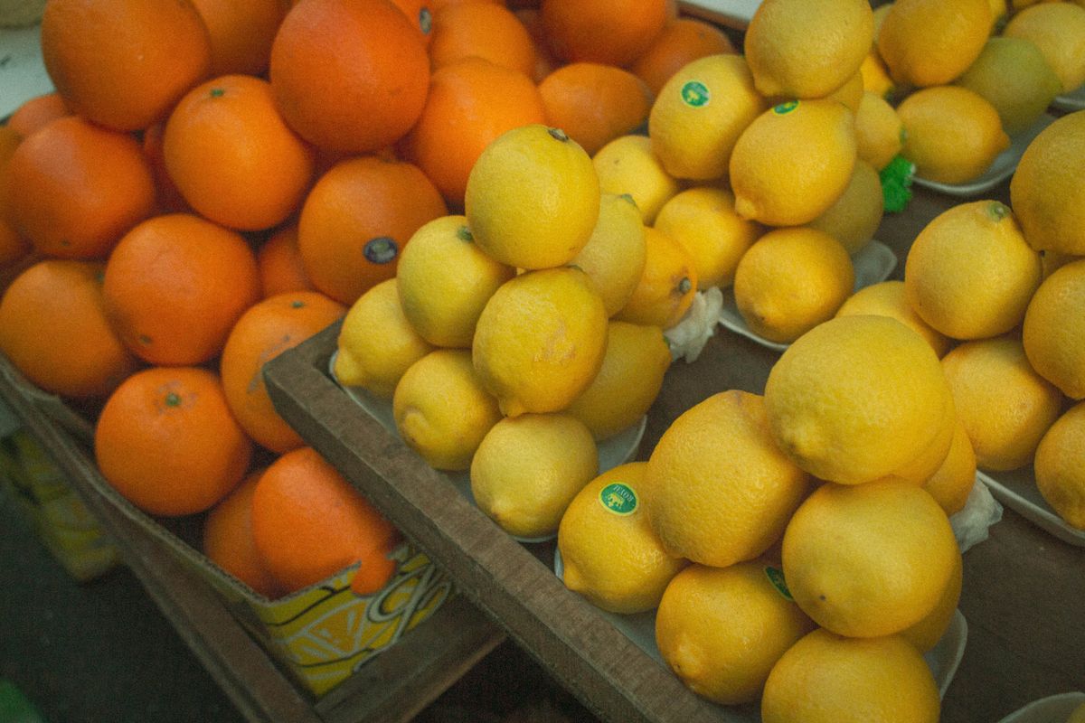 Fresh yellow lemons arranged on a kitchen counter