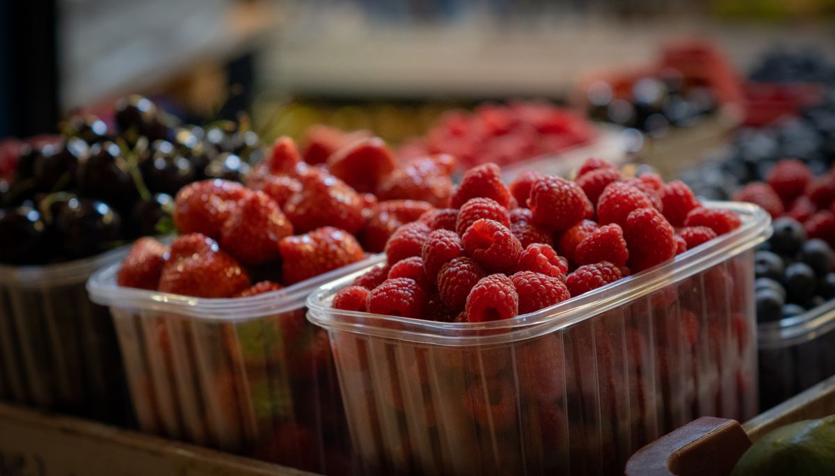 Fresh mixed berries in a bowl on a kitchen counter