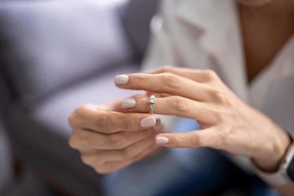 Woman removing her wedding ring