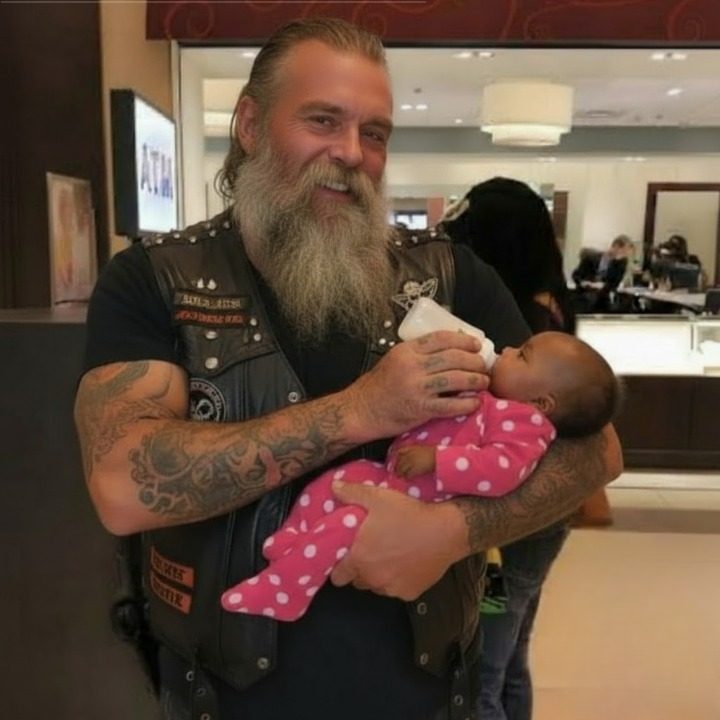 Bearded tattooed man wearing leather vest