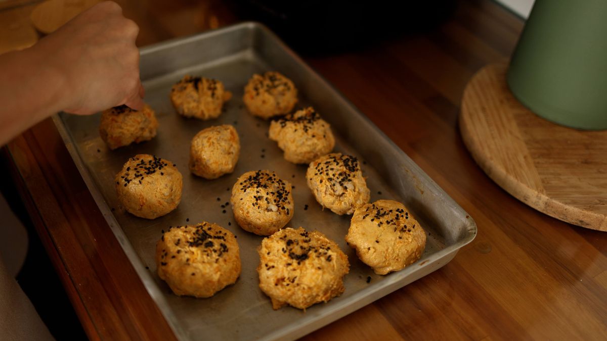 Pumpkin seeds spread on a baking tray before roasting