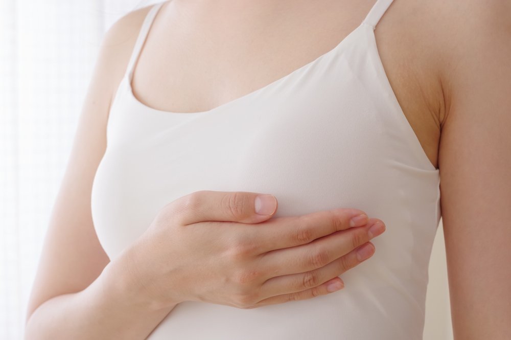 Woman enjoying the comfort of her small chest