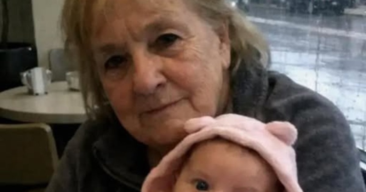 Two policemen with a grandmother and her baby