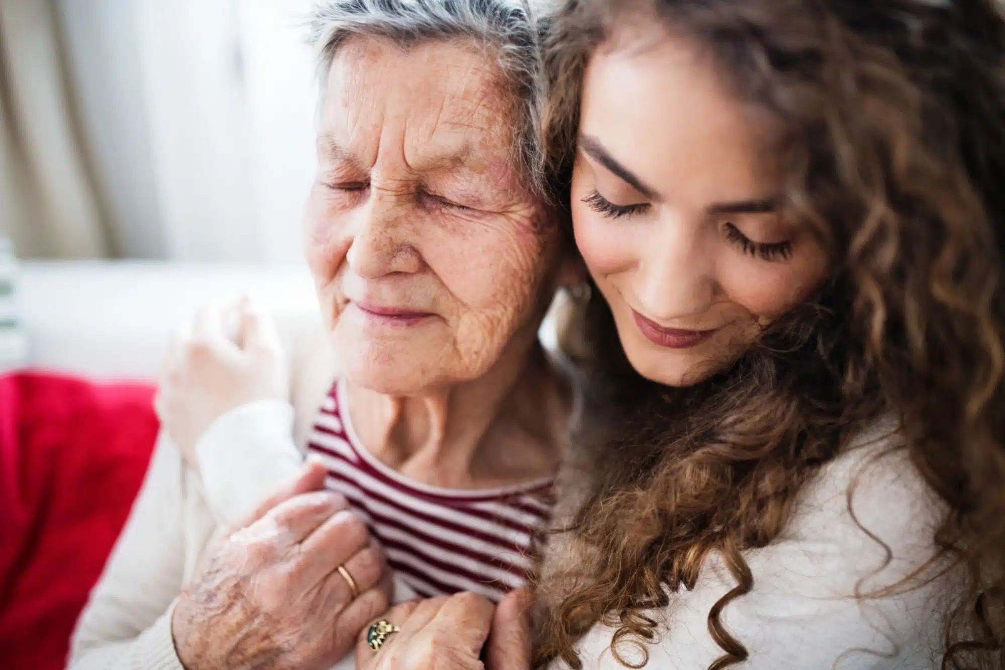 Young woman comforting a mother