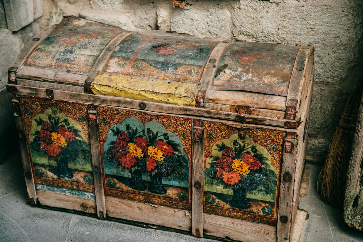 Old wooden locked chest in an attic