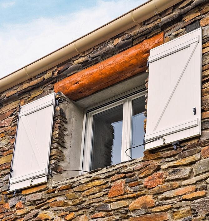 Open shutters letting natural light in
