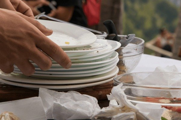 Waiter cleaning a table