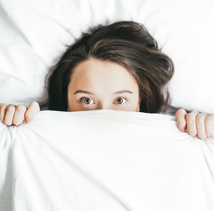 Person lying awake but immobilized