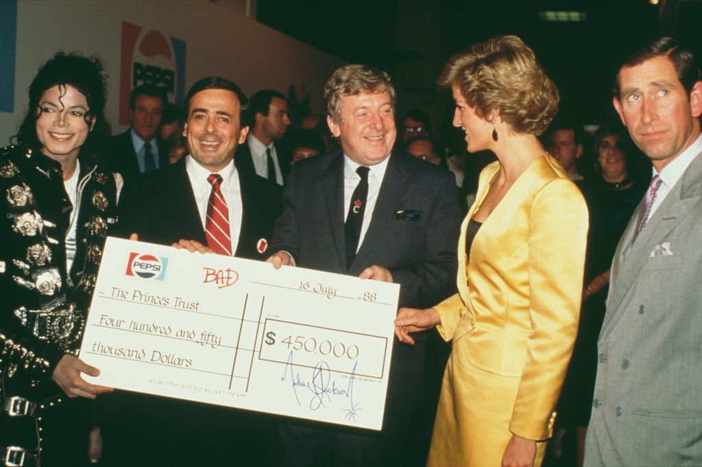 Michael Jackson handing over a check